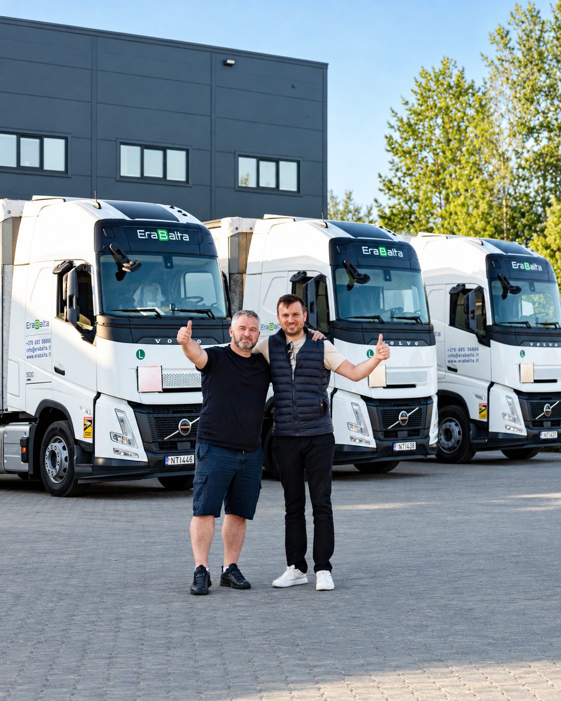 The Erabalta team in front of the company's trucks