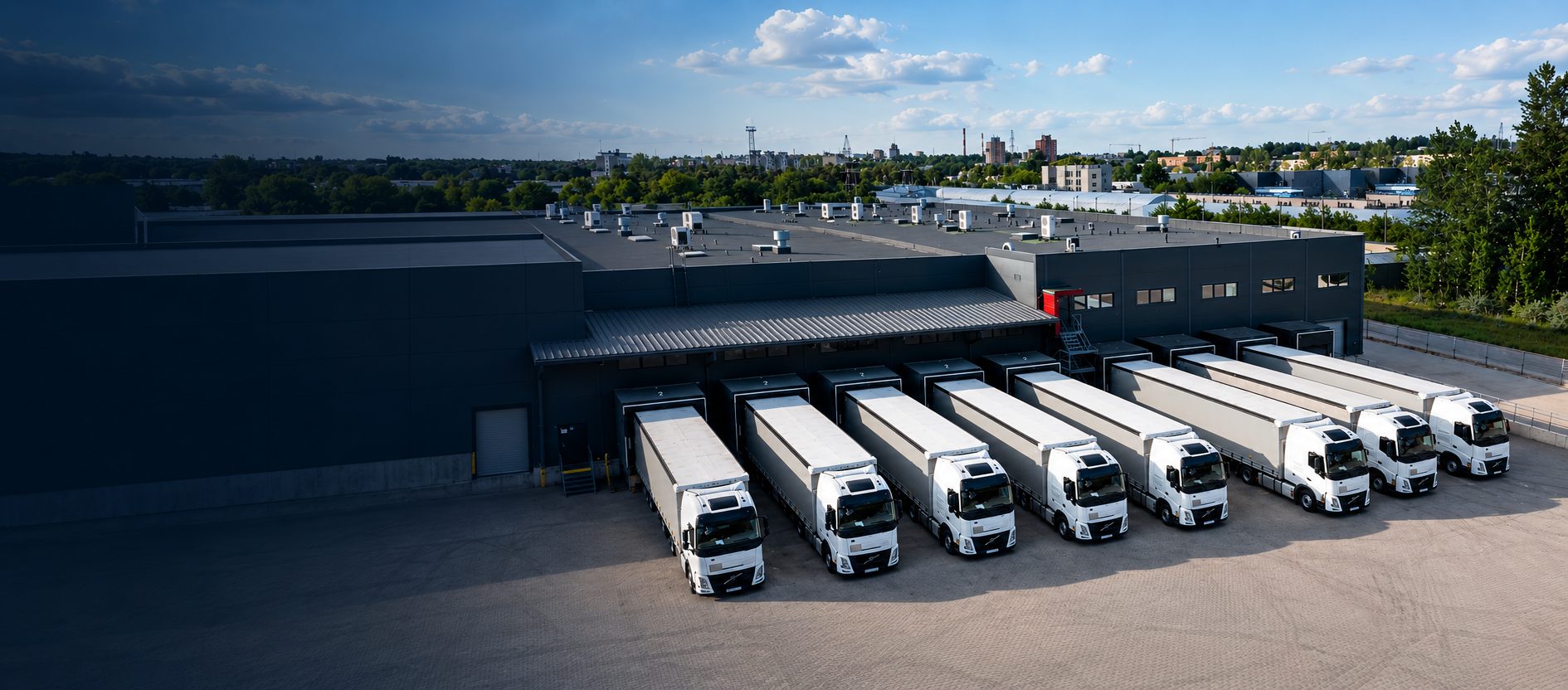 Logistics partner Erabalta: aerial view of trucks at the loading docks of a logistics terminal