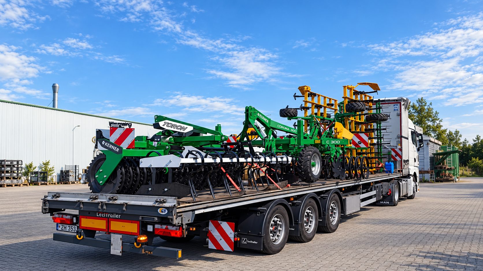 Transport services: agricultural machinery secured on a low-loader semi-trailer