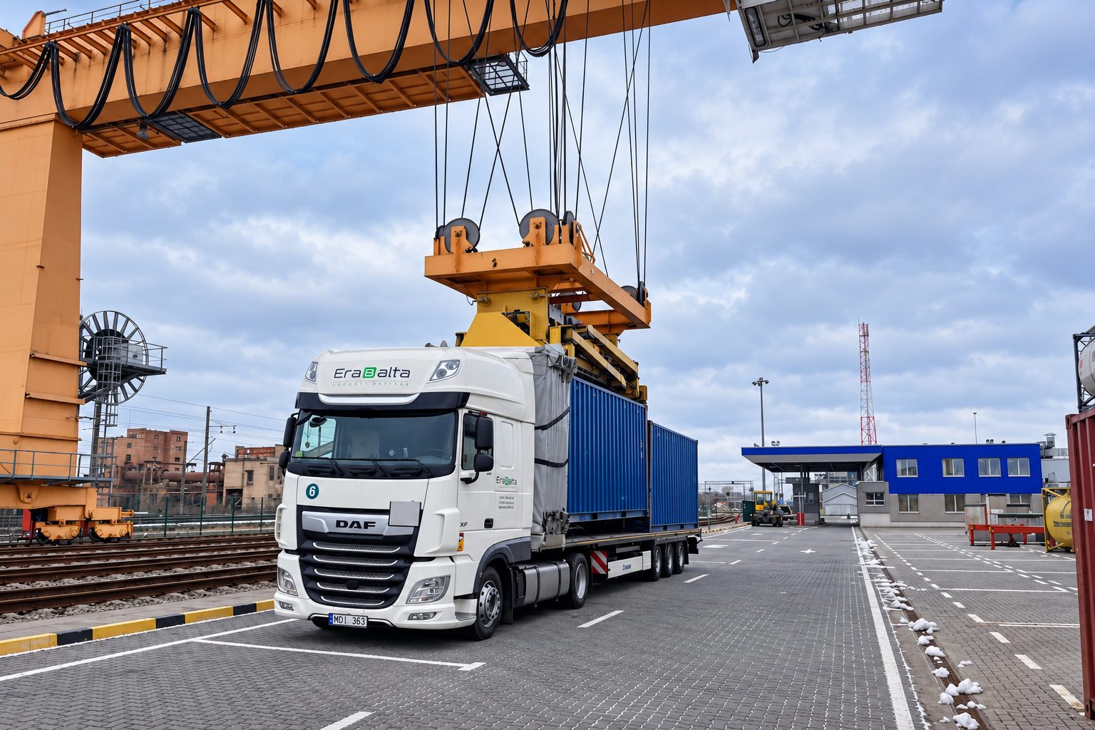 Erabalta truck with containers at a container terminal under a gantry crane