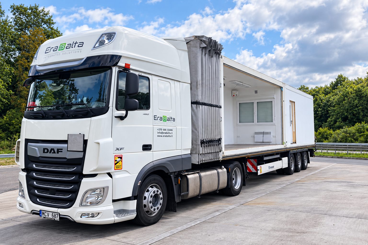 Erabalta truck with a modular building unit on a flatbed semi-trailer