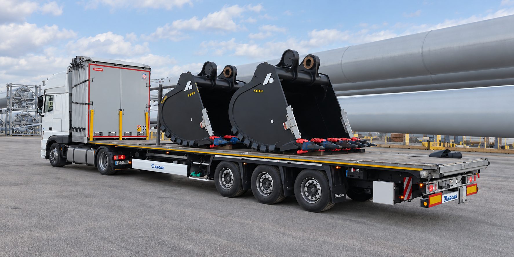 Heavy machinery buckets on a flatbed